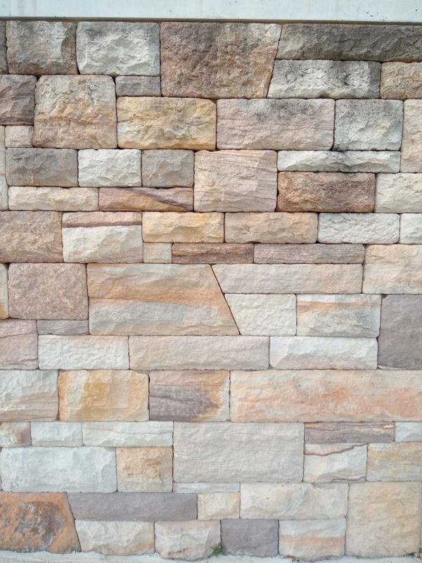 Natural Sydney sandstone wall laid in random ashlar coursing